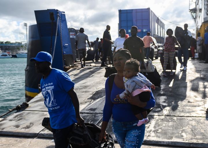 Evacuees get off a ferry after leaving Marsh Harbour on Abaco Island in the aftermath of hurricane Dorian on Sept. 9. Preside