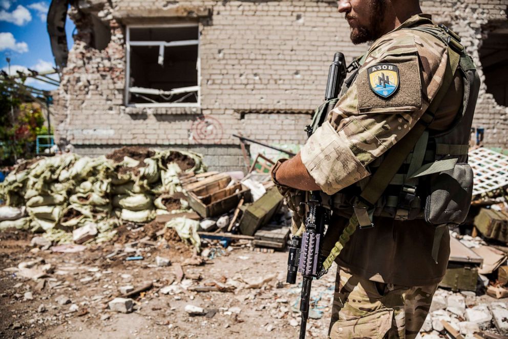 PHOTO: Soldier of the Azov battalion patrolling close to a Ukrainian bombed position in Shyrokyne, Ukraine, July 22, 2015.