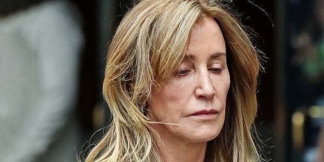 Actress Felicity Huffman was among 51 people charged in a scheme in which prosecutors say wealthy parents paid an admissions consultant to bribe coaches and test administrators to help their children get into prestigious colleges. (Photo by David L. Ryan/The Boston Globe via Getty Images)