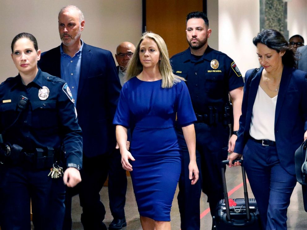 PHOTO: Former Dallas police officer Amber Guyger, center, arrives for the first day of her murder trial in the 204th District Court at the Frank Crowley Courts Building in Dallas, Texas, Sept. 23, 2019. 