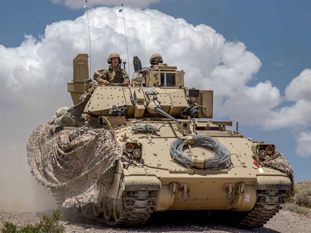 PHOTO: Soldiers from 1st Battalion, 163rd Cavalry Regiment, Montana Army National Guard, push on in their Bradley Fighting Vehicle during a defensive attack training exercise at the National Training Center (NTC) in Fort Irwin, Calif., June 1, 2019.