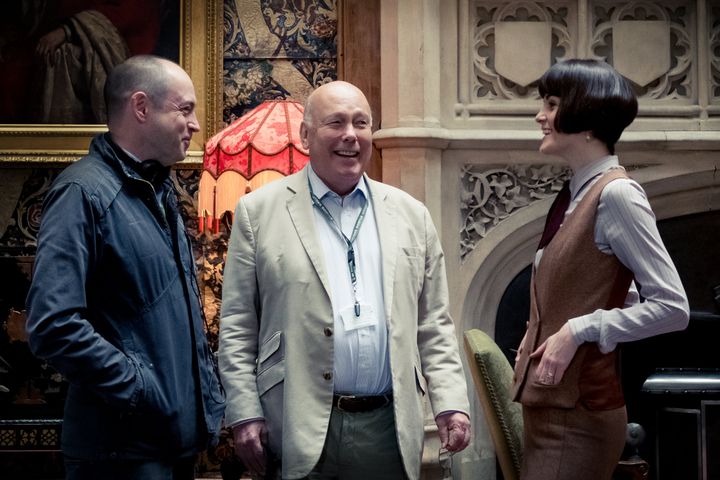Producer Gareth Neame, writer and producer Julian Fellowes and actor Michelle Dockery on the set of "Downton Abbey," a Focus 