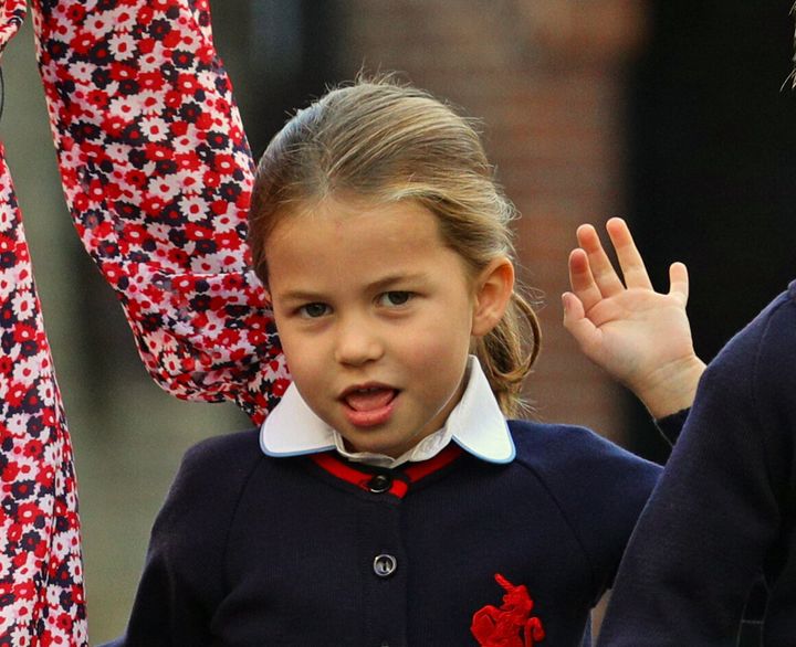 Princess Charlotte waving as she heads to school.