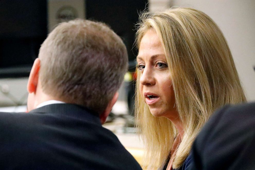 PHOTO: Former Dallas police officer Amber Guyger confers with her attorney before proceedings in her murder trial, Sept. 25, 2019, in Dallas.