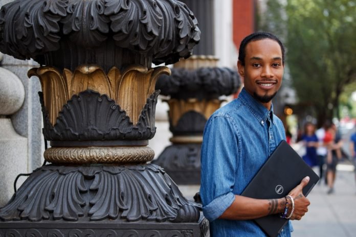 Hadi Shakuur, CEO and founder of Muzbnb, poses for a photograph Friday, Aug. 2, 2019, in Washington. (AP Photo/Alex Brandon)