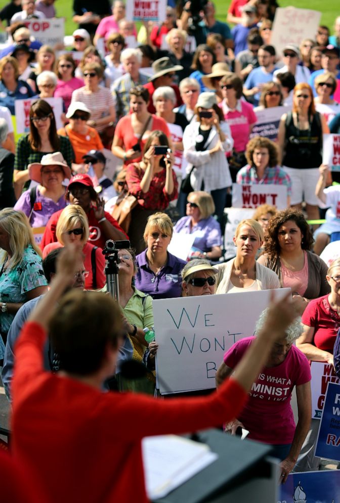 PHOTO: The crowd watches as Stephanie Kight, President and CEO of Planned Parenthood of Greater Ohio, speaks during the We Wont Go Back Statehouse Rally organized by more than 55 Ohio groups at the Ohio Statehouse, Oct. 2, 2013, in Columbus, Ohio.