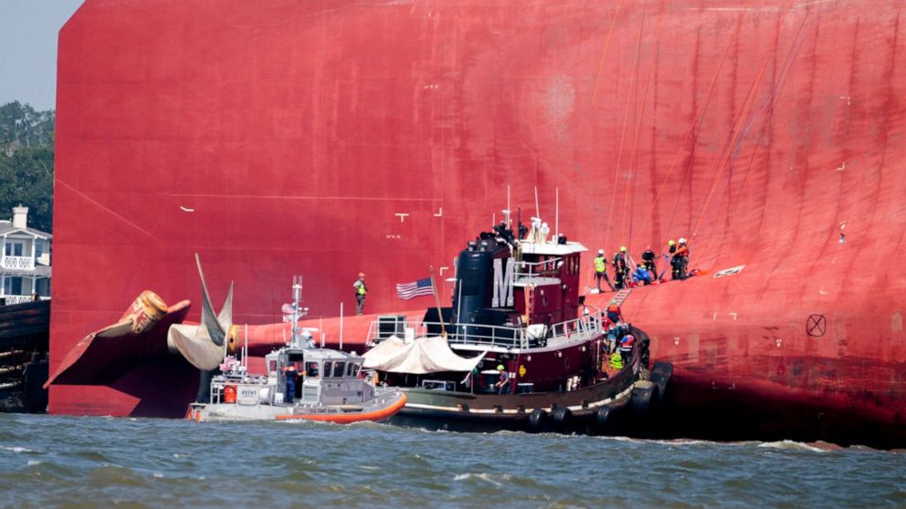 PHOTO: Rescuers work near the stern of the vessel Golden Ray as it lays on its side near the Moran tug boat Dorothy Moran, Sept. 9, 2019, in Jekyll Island, Ga.