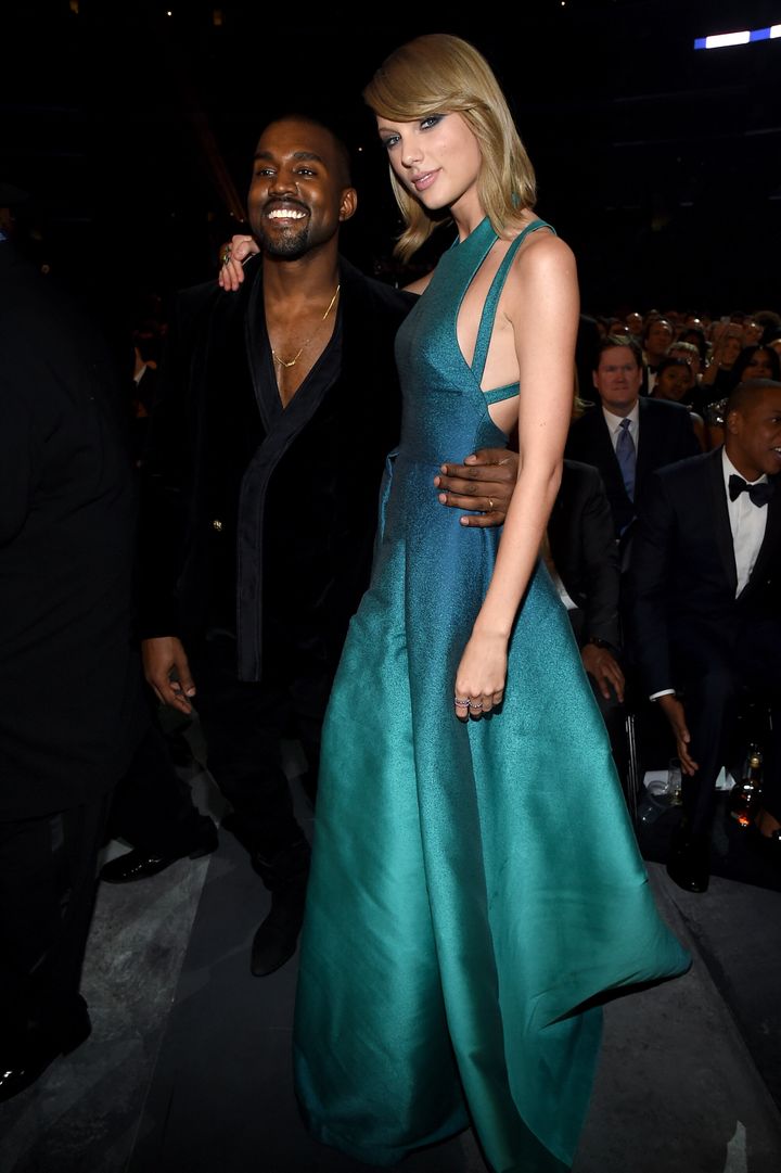 Kanye West and Taylor Swift pose for a photo together at the 2015 Grammys.&nbsp;