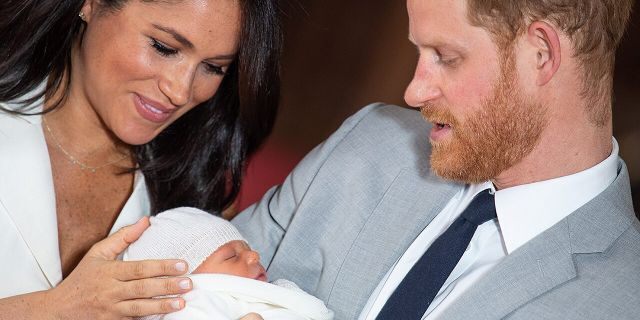 Meghan Markle and Prince Harry cooing over baby Archie Harrison Mountbatten-Windsor. The royal baby is their firstborn son.