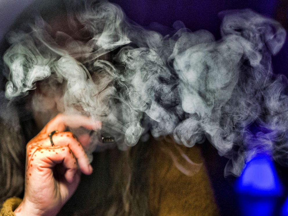 PHOTO: A woman takes a puff from a cannabis vape pen in Los Angeles, Dec. 22, 2018.