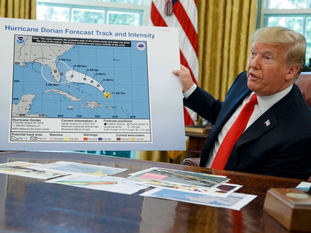 PHOTO: President Donald Trump talks with reporters after receiving a briefing on Hurricane Dorian in the Oval Office of the White House, Sept. 4, 2019, in Washington.