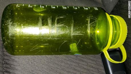 The family carved &#39;HELP&#39; on a green bottle