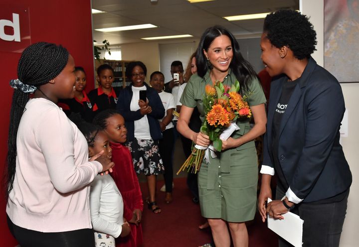 The Duchess of Sussex was presented flowers by Luyanda, age 8, during her visit to ActionAid.