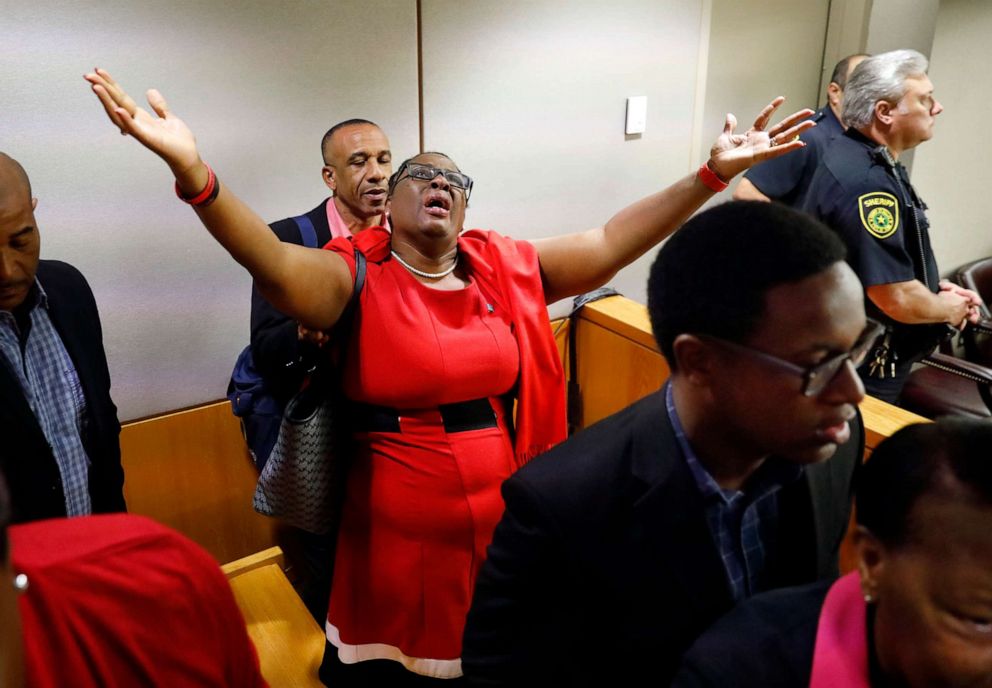 PHOTO: Botham Jeans mother, Allison Jean, rejoices in the courtroom after fired Dallas police Officer Amber Guyger was found guilty of murder, Oct. 1, 2019, in Dallas.