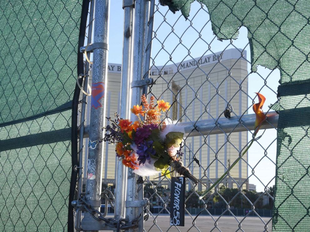PHOTO: Flowers and a sign reading HONOR 58 hang on a fence outside the Las Vegas Village across from Mandalay Bay Resort and Casino as a tribute to those killed almost two years ago in a massacre at the site on Sept. 30, 2019, in Las Vegas.