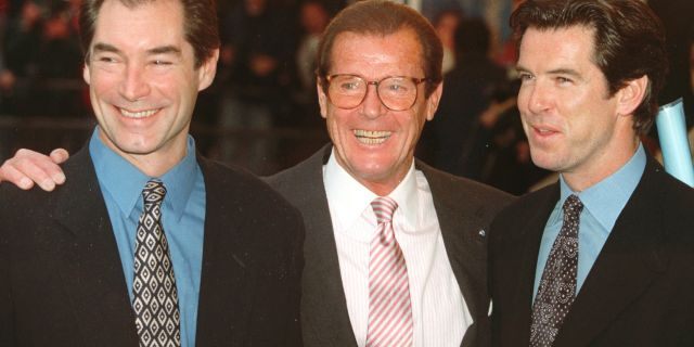 In this Sunday, Nov. 17, 1996 file photo, three of the actors who played James Bond, Timothy Dalton left, Roger Moore, center, and Pierce Brosnan, at a London cinema to celebrate the life of Albert R. "Cubby" Broccoli, the American film producer behind seventeen Bond movies.