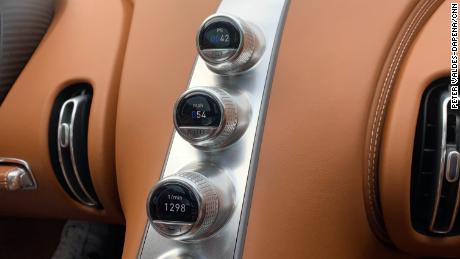 Rather than a large screen, the Chiron has discrete computer displays nested inside knobs.