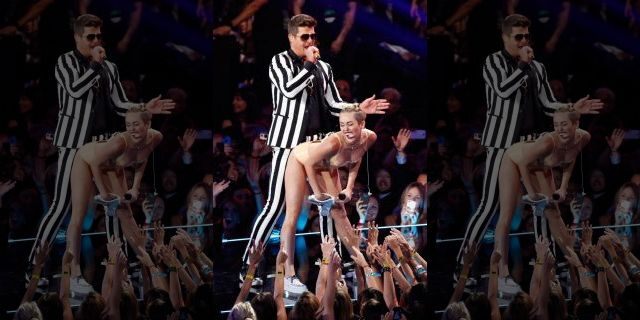 Robin Thicke performs "Blurred Lines" with Miley Cyrus during the 2013 MTV Video Music Awards in New York.