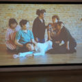 At the Harbourfront Centre’s Artport Gallery, Arin Rungjang presents his moving near-silent multi-channel video, 'Ravisara', which shows six female immigrants from Thailand to Germany performing choreographed movements on hardwood floors. At times, they come together to comfort each other.
