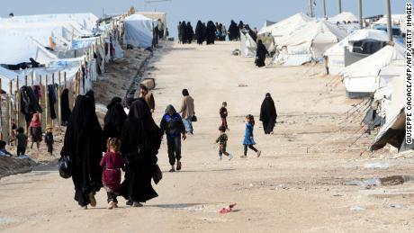 People in the al-Hol camp, which houses relatives of ISIS group members, in the camp in March.