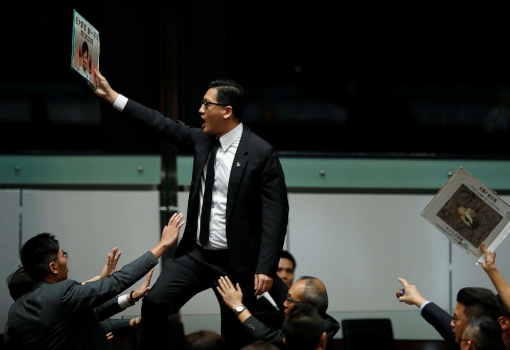 PHOTO: Lawmakers shout protests as Hong Kong Chief Executive Carrie Lam (not pictured) arrives to deliver her annual policy address, at the Legislative Council in Hong Kong, China, Oct. 16, 2019.