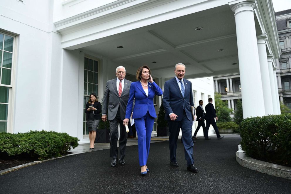 PHOTO: Speaker of the House Nancy Pelosi (C), Senate Minority Leader Chuck Schumer (D-NY) (R) and Representative Steny Hoyer, walk out of the White House after meeting with US President Donald Trump on Oct. 16, 2019.