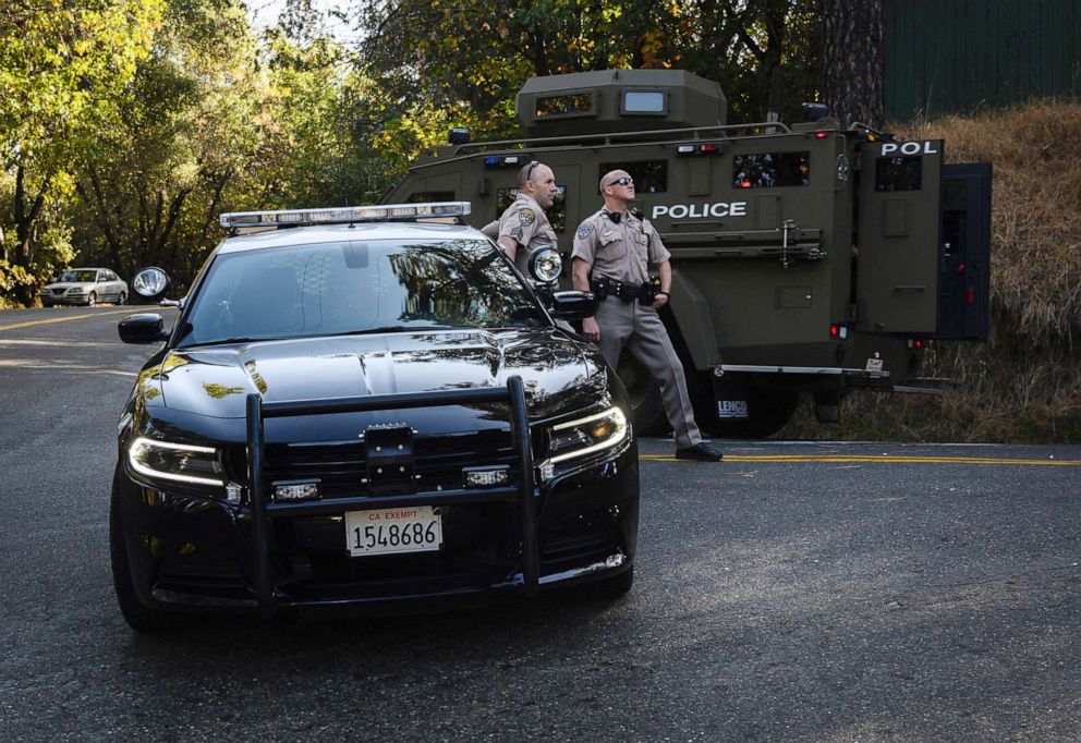 PHOTO: CCalifornia Highway Patrol officers block off a road where El Dorado County sheriffs deputy Brian Ishmael was killed responding to an early morning call, as an armored vehicle passes by in Somerset, Calif., Oct. 23, 2019.