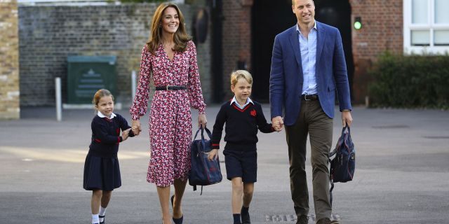 Britain's Princess Charlotte, left, with her brother Prince George and their parents Prince William and Kate, Duchess of Cambridge, arrives for her first day of school at Thomas's Battersea in London, Thursday, Sept. 5, 2019.