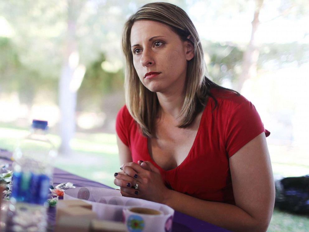 PHOTO: Then-Democratic congressional candidate Katie Hill, speaks to a constituent at a Halloween carnival on Oct. 21, 2018, in Lancaster, Calif.