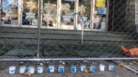 Eleven memorial candles for the victims remain outside the Tree of Life synagogue.