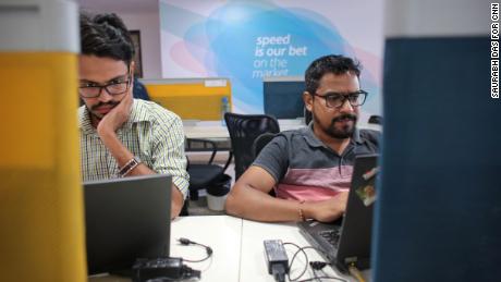 Employees at Paytm&#39;s headquarters, which is decorated with phrases like &quot;Go big or go home&quot; and &quot;speed is our bet.&quot; (Saurabh Das for CNN)