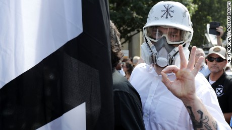 A member of the alt-right displays an &#39;OK&#39; sign at Charlottesville - one of the seemingly innocuous gestures co-opted by the white power movement.