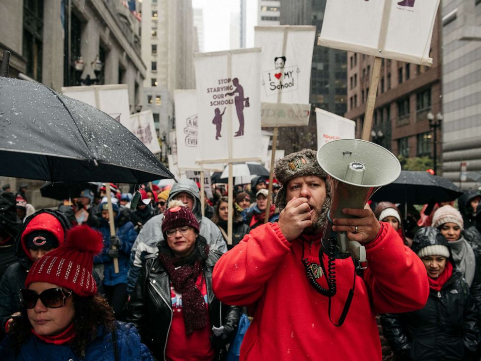 PHOTO: Braving snow and cold temperatures, thousands marched through the streets near City Hall during the 11th day of an ongoing teachers strike, Oct. 31, 2019, in Chicago, Illinois.