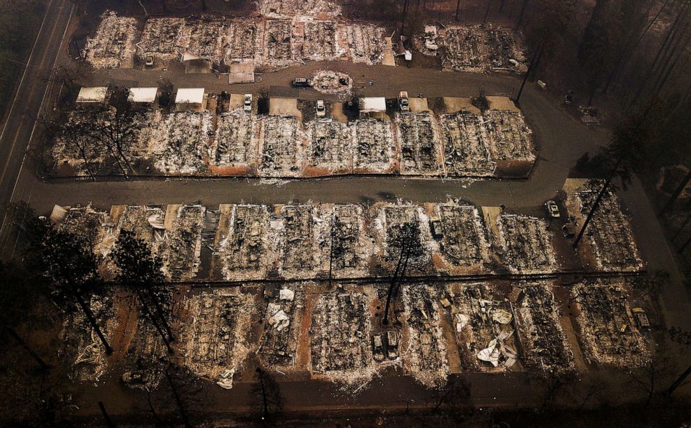 PHOTO: This Nov. 15, 2018, aerial file photo shows the remains of residences leveled by the Camp wildfire in Paradise, Calif.