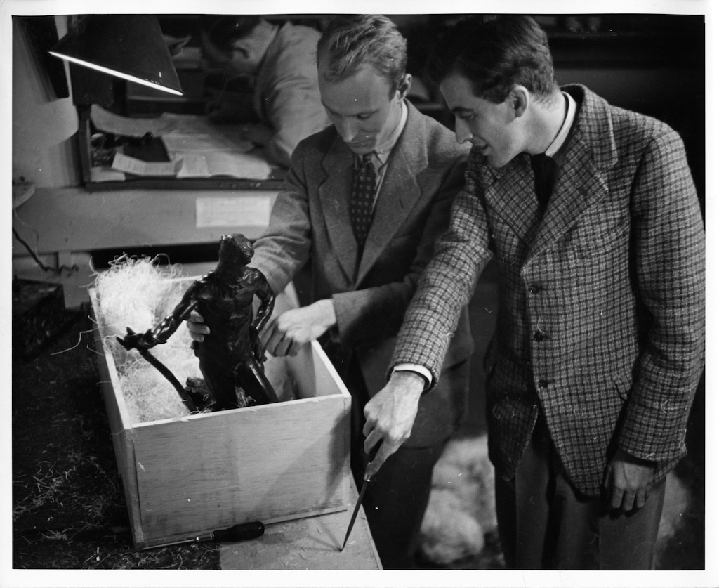 Gordon Washburn (right), who became director of the Albright-Knox Art Gallery at age 27 in 1931, and members of the Albright Art Gallery staff prepare for the 1937 exhibition "Master Bronzes, Selected from Museums and Collections in America"