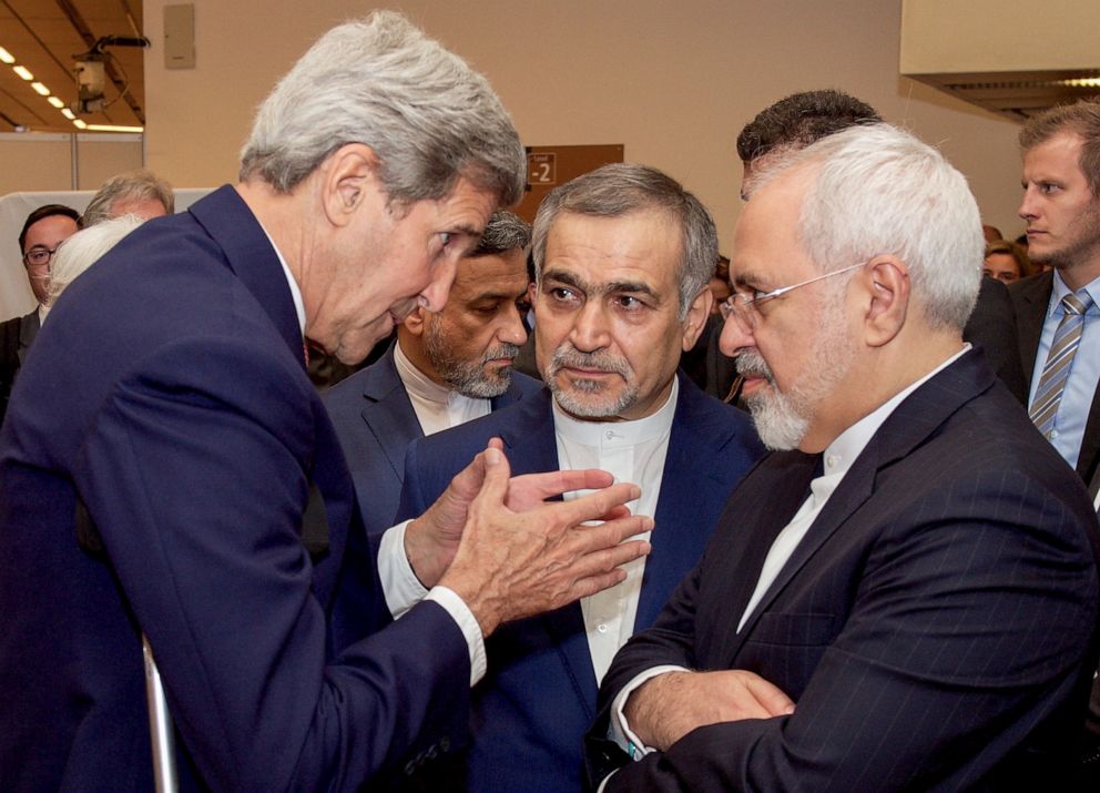 PHOTO: U.S. Secretary of State John Kerry (L) speaks with Hossein Fereydoun (C), the brother of Iranian President Hassan Rouhani, and Iranian Foreign Minister Javad Zarif (R), at the Austria Center in Vienna, Austria, July 14, 2015.