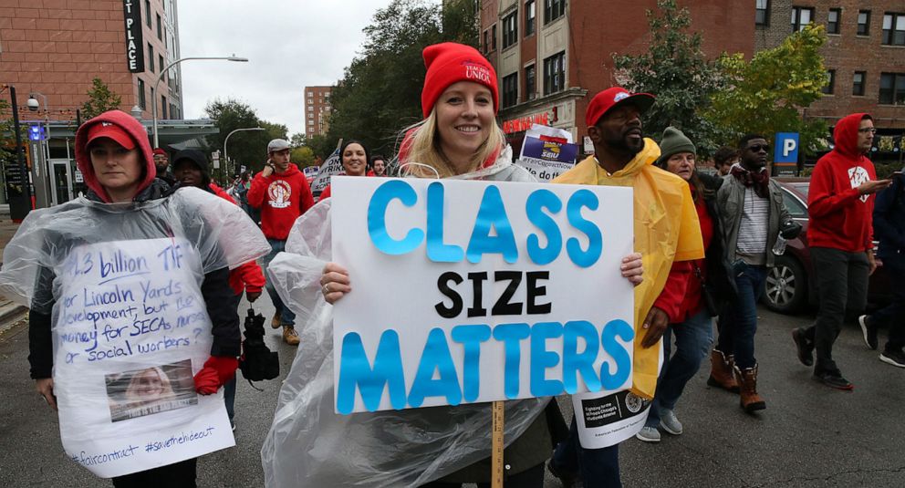 PHOTO: Chicago Teachers Union members and supporters march through the streets of Chicagos Hyde Park neighborhood during the Nurse in Every School Solidarity March for Justice, Oct. 21, 2019.