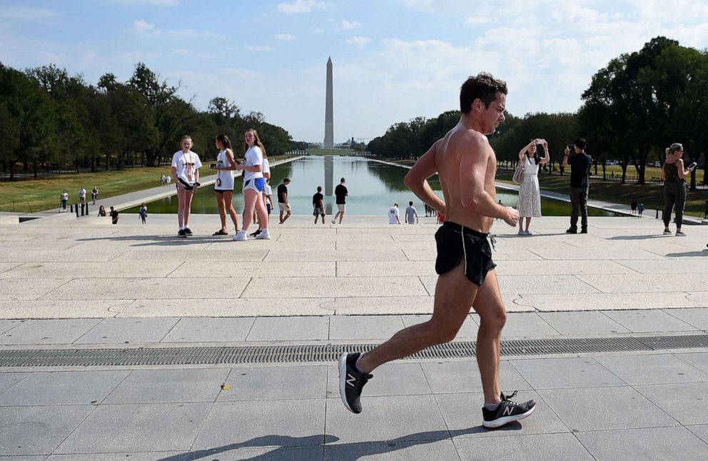 PHOTO: A man runs pass the Lincoln Memorial on the National Mall as temperatures are expected to soar into mid-90s (32C), on October 2, 2019, in Washington, DC.