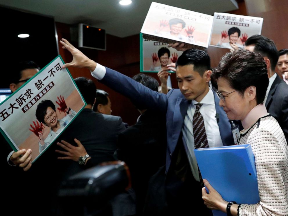 PHOTO: Hong Kong Chief Executive Carrie Lam arrives to deliver her annual policy address, as lawmakers shout protests, at the Legislative Council in Hong Kong, China, Oct. 16, 2019.