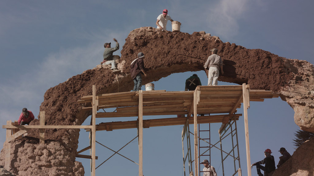 Construction of an artificial arch in 'I Am Afraid, I Must Ask You to Leave,' 2018, film still