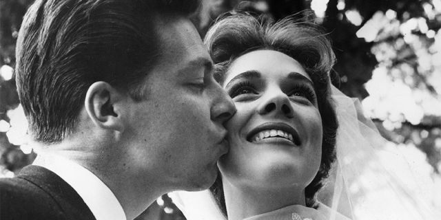 British costume designer Tony Walton kisses the cheek of his new bride, British actor and singer Julie Andrews. Their marriage lasted from 1959 until 1967.