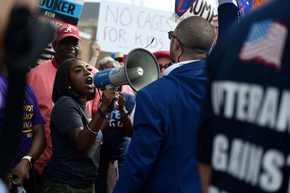 PHOTO: A supporter of President Donald Trump, right, clashes with an anti-Trump protester, left, outside the presidents appearance at a criminal justice forum on Friday, Oct. 25, 2019, in Columbia, S.C.