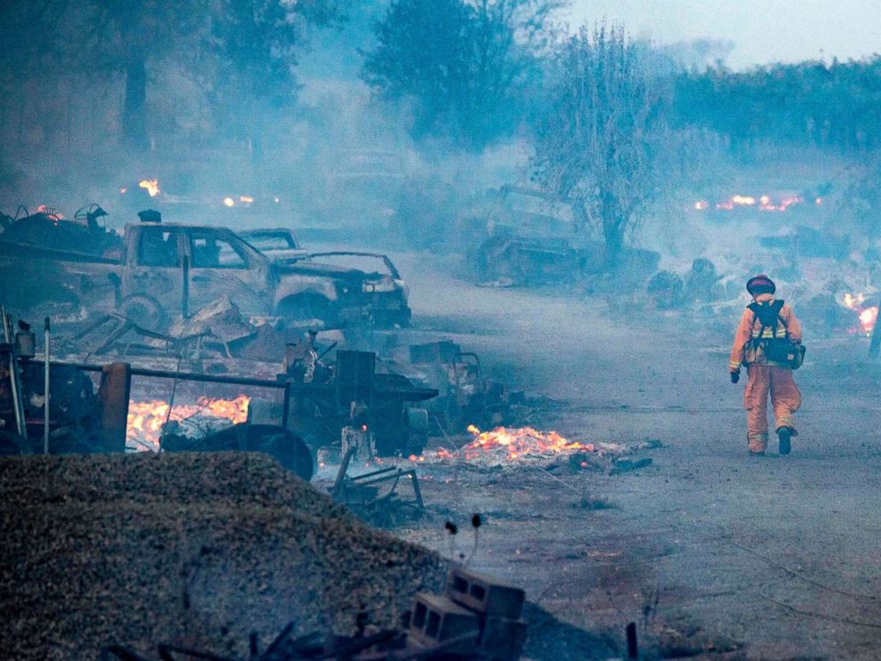 PHOTO: A firefighter walks through a burned property after the Kincade fire tore through Healdsburg, Calif., Oct. 27, 2019.