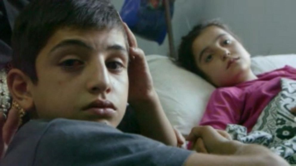 PHOTO: Sara and her brother Ahmed lost their brother Mohammed, who was just 13, in an artillery explosion.