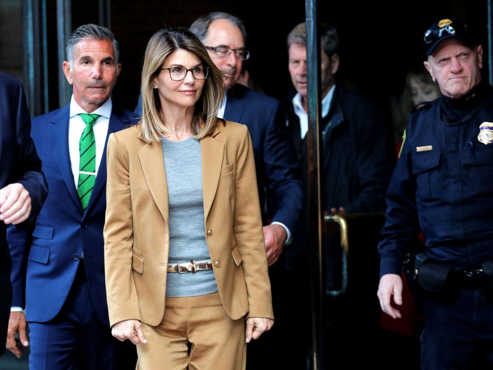 PHOTO: Lori Loughlin, and husband Mossimo Giannulli facing charges in a nationwide college admissions cheating scheme, leave federal court in Boston, April 3, 2019.