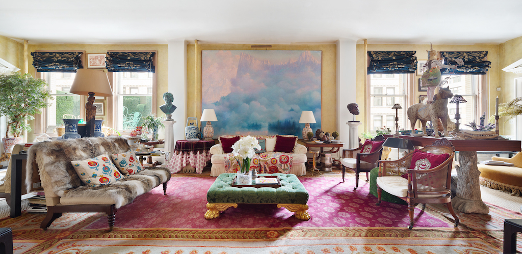 A painting by Lucien Lévy-Dhurmer serves as the centerpiece for the large living room in the apartment
