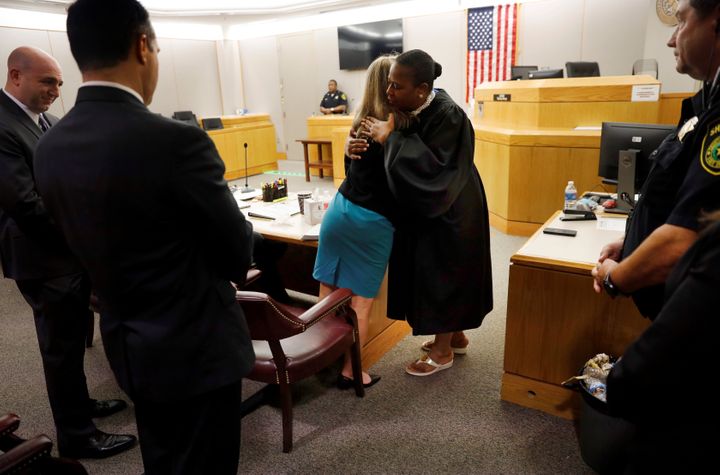 Amber Guyger gives Judge Tammy Kemp a hug at the Frank Crowley Courts Building in Dallas, Texas, U.S. October 2, 2019.