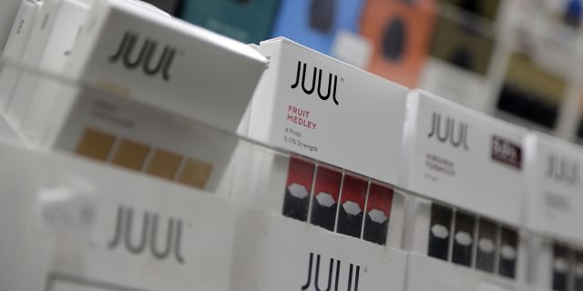In this Dec. 20, 2018, file photo Juul products are displayed at a smoke shop in New York. (AP Photo/Seth Wenig)
