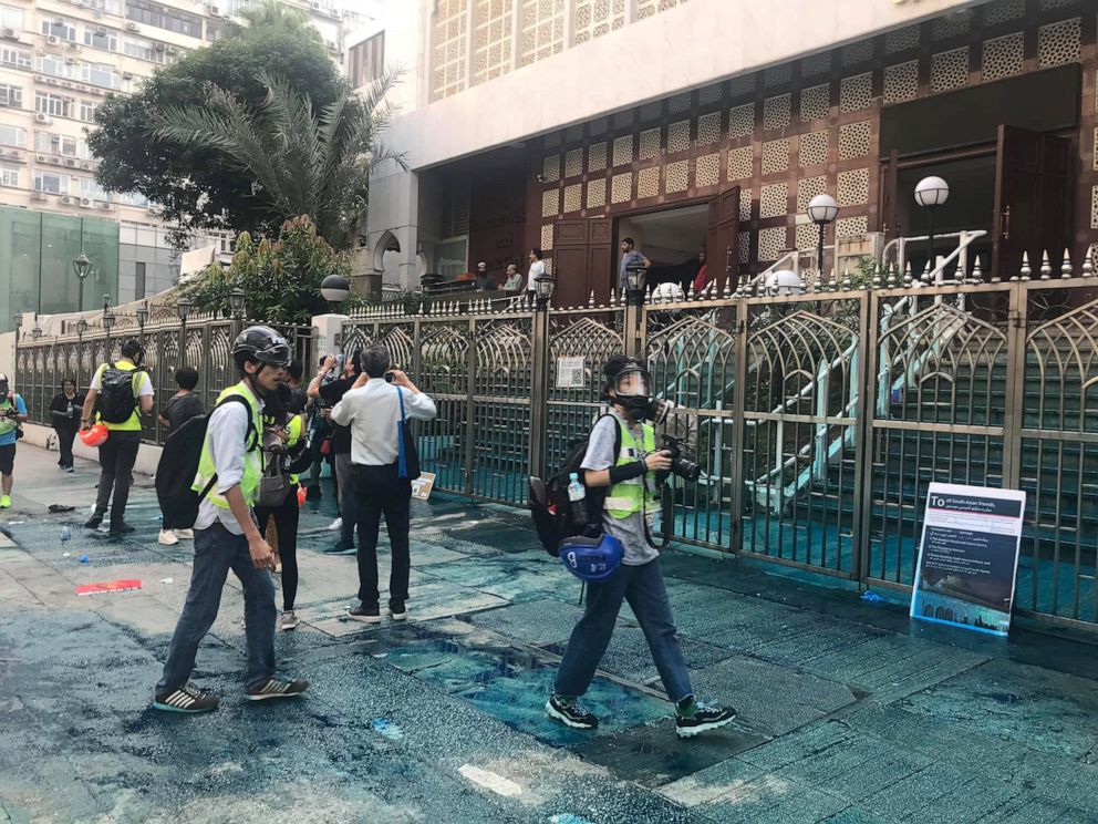 PHOTO: Members of the press are seen outside the Kowloon Masjid and Islamic Centre in Hong Kong after police doused it with a water cannon, Oct. 20, 2019.