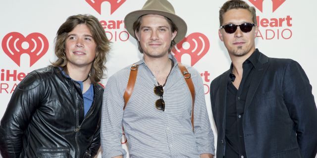 From left, Zac, Taylor, and Isaac Hanson, arrive at the iHeartRadio Music Festival at the MGM Grand Garden Arena in Las Vegas.